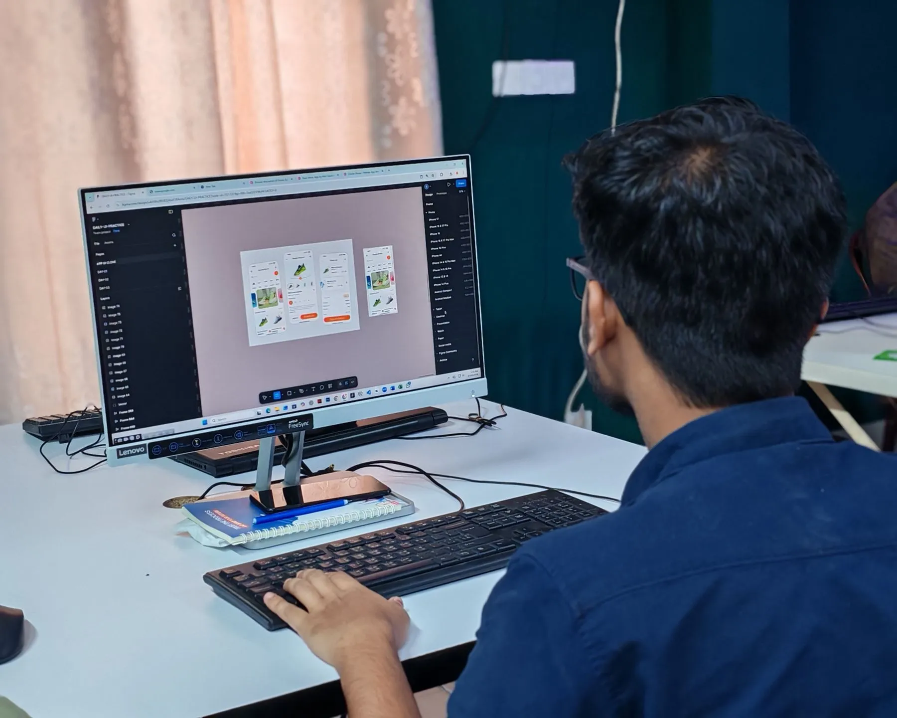 A designer working on an interface at a desk